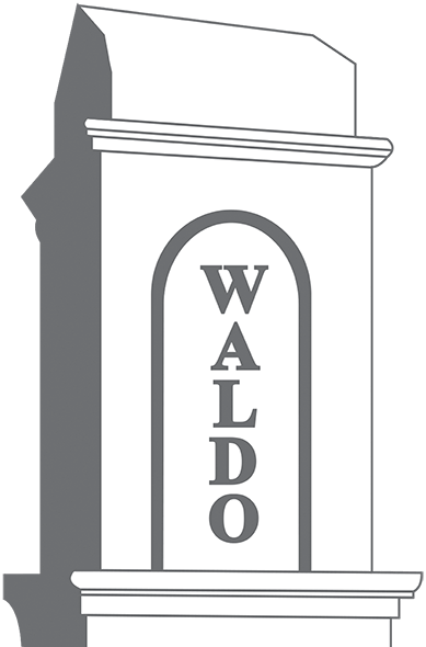 Illustration of a stone pillar with an arched inset labeled 'waldo' in uppercase letters, suggestive of a monument or architectural detail.